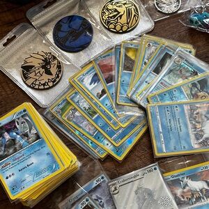 Pokemon Card Collection with Tins and Accessories 25 card Mystery Tin plus bonus